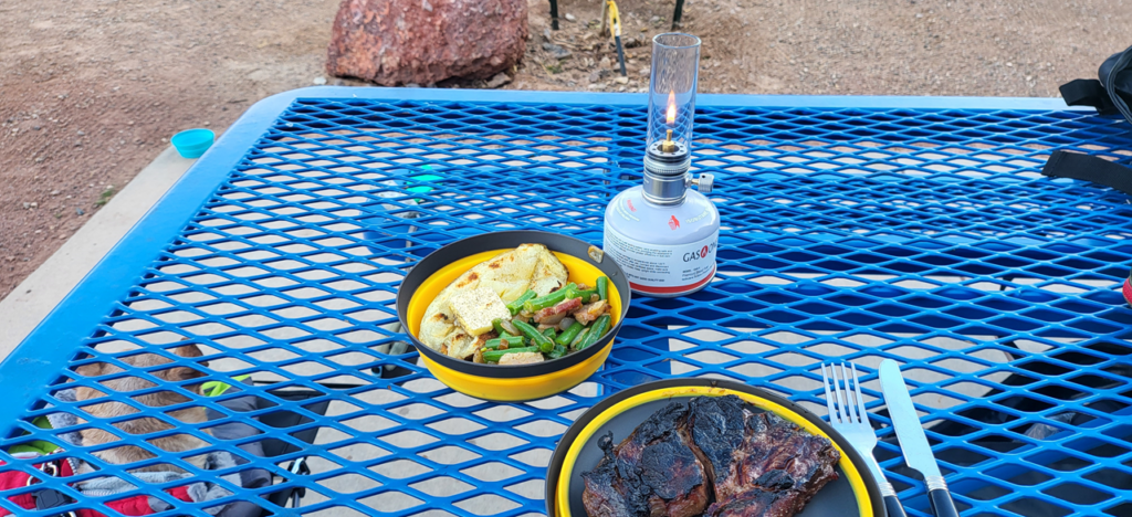 The CAMPINGMOON gas candle adds a touch of ambiance to your campsite.